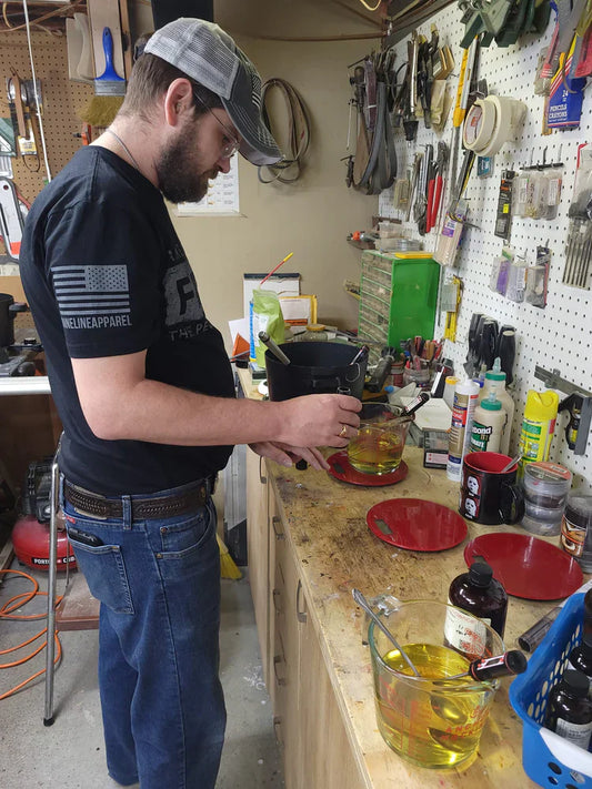 Veteran-owned candle maker pouring soy wax in workshop in Buffalo, NY
